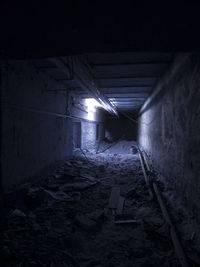 Illuminated walkway at night