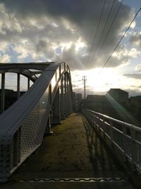 Footbridge against sky