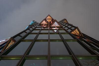 Low angle view of illuminated building against sky