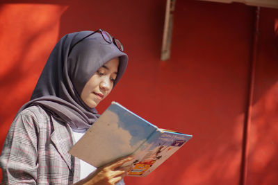 Young woman using digital tablet