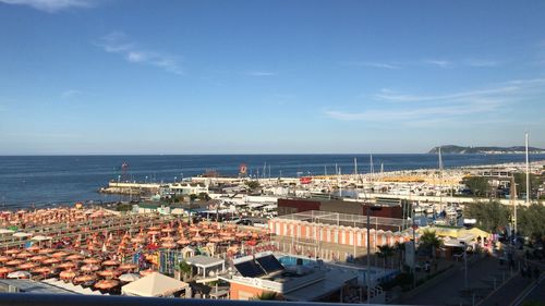 High angle view of harbor by sea against sky