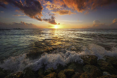 Scenic view of sea against sky during sunset