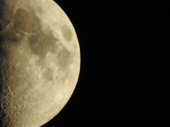 Low angle view of moon against clear sky at night