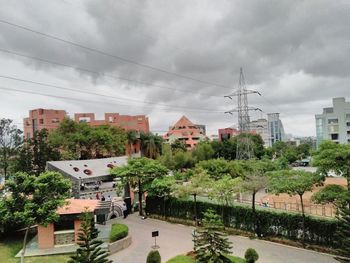 Buildings against cloudy sky