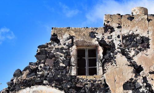 Low angle view of old building against sky. oia, santorini, greece 