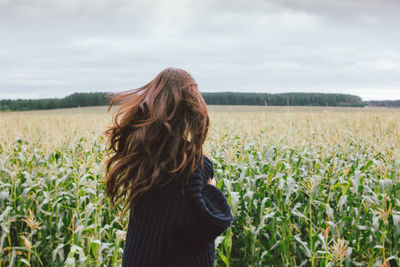 Woman standing in field