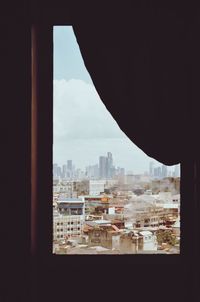 Cityscape seen through window
