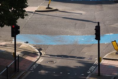 High angle view of man walking on road