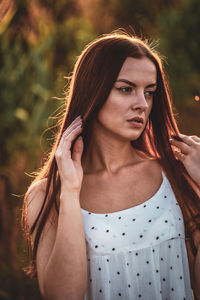 Portrait of young woman looking away