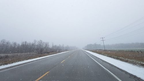 Road against sky during winter