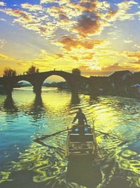 Scenic view of river at sunset