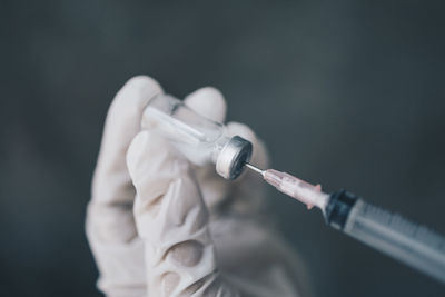 Close-up of human hand holding cigarette