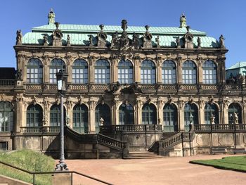 Facade of old building against clear sky