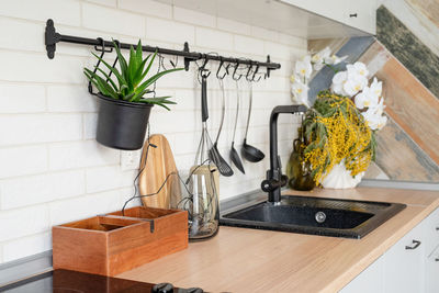 Interior of kitchen in rustic style with vintage kitchen ware and wooden wall