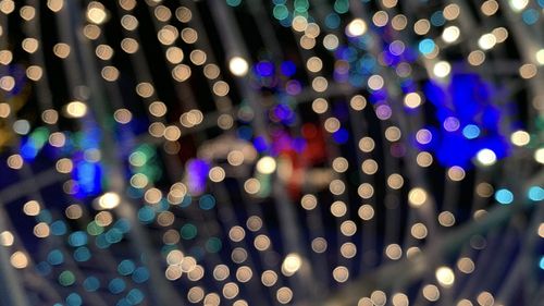 Defocused image of illuminated lights at night