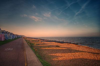 Scenic view of beach against sky during sunset