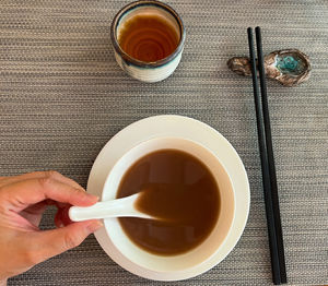 High angle view of scooping soup on table