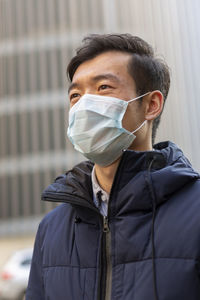 Portrait of young man standing outdoors