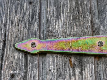 Close-up of metal on wooden door