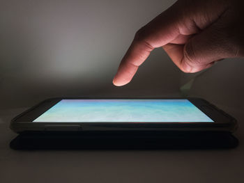 Close-up of hand holding smart phone