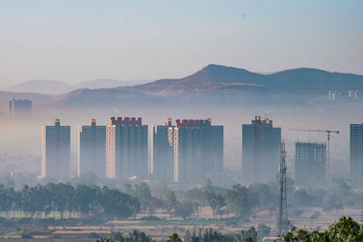 View of cityscape with mountain range in background