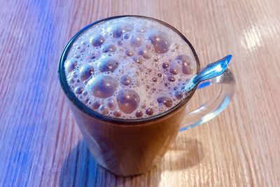 High angle view of drink in glass on table