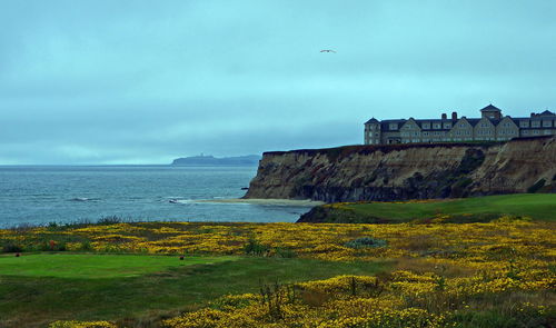 Scenic view of sea against cloudy sky