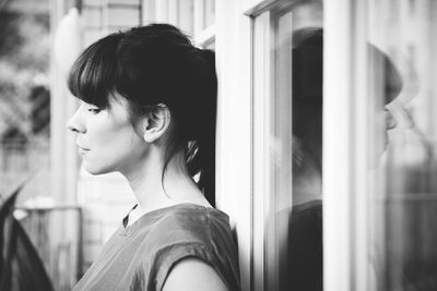 Woman by window at home