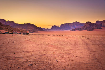 Dramatic wadi rum desert scene during sunset.