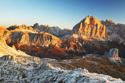 Rock formations on landscape against sky