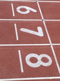 High angle view of numbers on running tracks