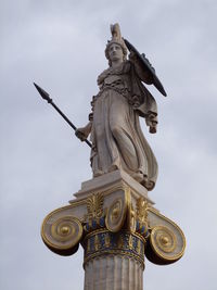 Statue of goddess athena against sky