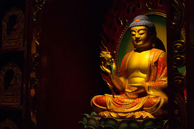 Close-up of statue against temple