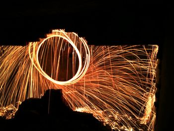 Light trails against sky at night