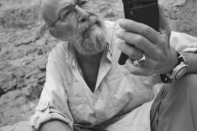 Portrait of man using mobile phone