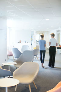 Young women talking in office