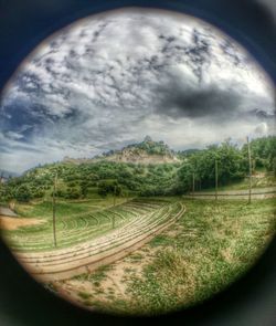 View of landscape against cloudy sky