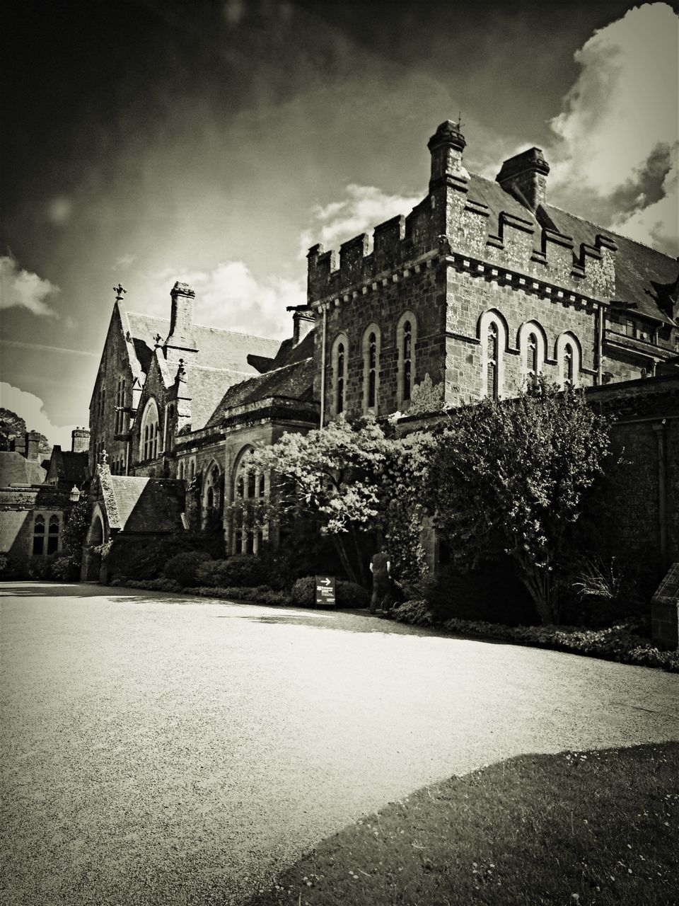 architecture, built structure, building exterior, sky, church, religion, cloud - sky, place of worship, street, spirituality, cloud, low angle view, city, arch, outdoors, day, no people, history