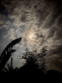 Low angle view of silhouette trees against sky at sunset