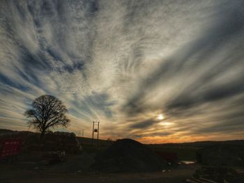 Scenic view of landscape against sky at sunset