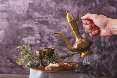 Cropped hand of person preparing food