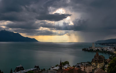 Panoramic view of sea and buildings against sky