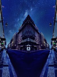 Illuminated street light against blue sky