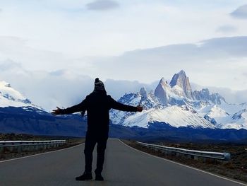 Man standing on snow covered mountain