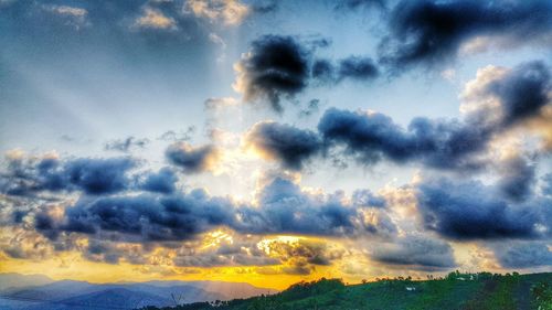 Scenic view of landscape against sky at sunset