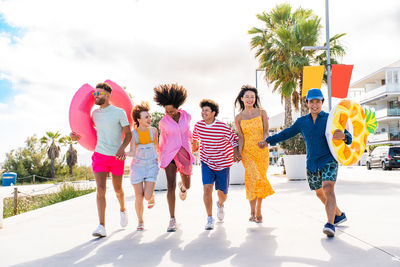 Group of family walking on road