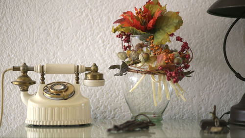 Close-up of vase on table at home