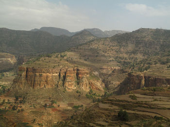 Scenic view of landscape and mountains against sky