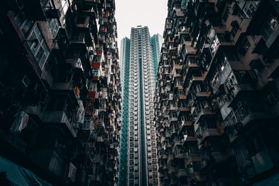 Low angle view of buildings in city against sky