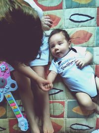 High angle view of mother and daughter at home